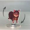 A small, dark brown tabby cat figure mounted on a clear acrylic base, designed to spin.
