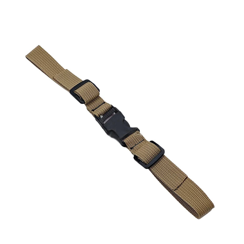 A close-up view of a tan adjustable backpack chest strap with black accents.
