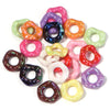 A collection of colorful acrylic spacer beads shaped like waves in various shades including pink, purple, green, and orange.