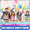 A group of happy children holding colorful magnetic drawing board keychains as party favors.