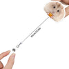 A small, fluffy hamster is shown next to a retractable badge reel with an alligator clip.