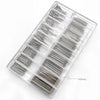 A clear plastic tray containing an assortment of stainless steel watch spring bars.