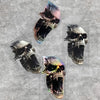 A collection of stylized skull decals featuring vibrant, iridescent colors and dark shading on a gray background.