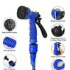A blue expandable magic hose with a flat nozzle, featuring an energy-saving lever and durable construction.