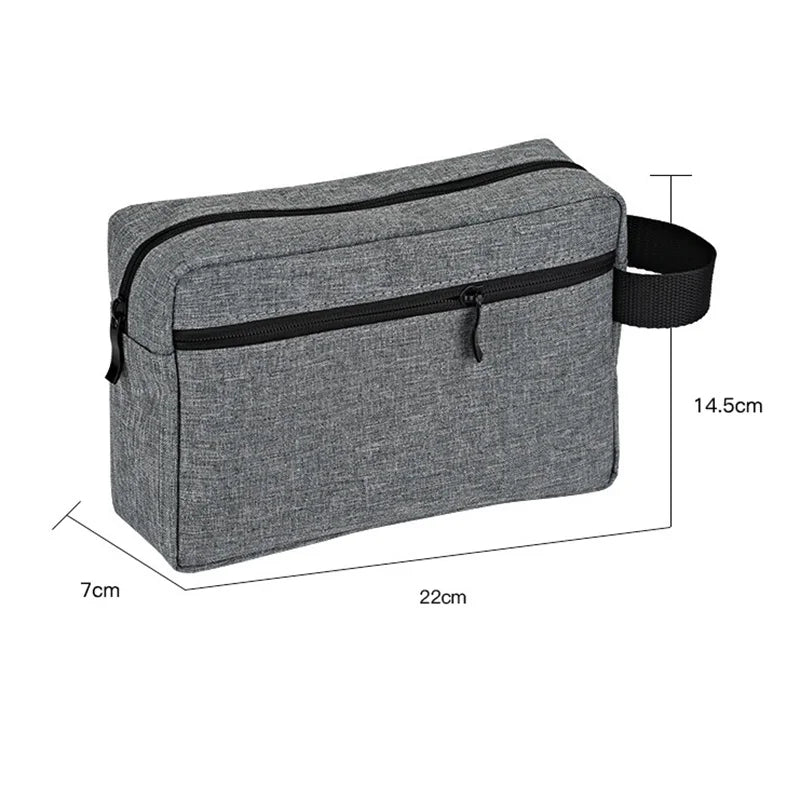 A gray waterproof travel toiletry bag with a black zipper and adjustable strap.