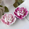 Pink and white heart-shaped silicone flower molds for crafting projects