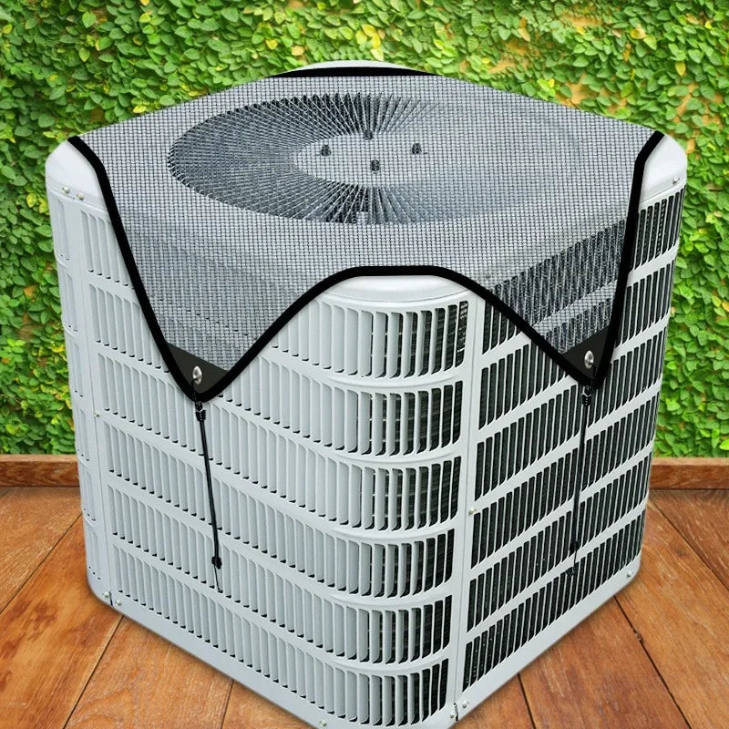 A white outdoor air conditioner unit covered with a breathable black mesh fabric.