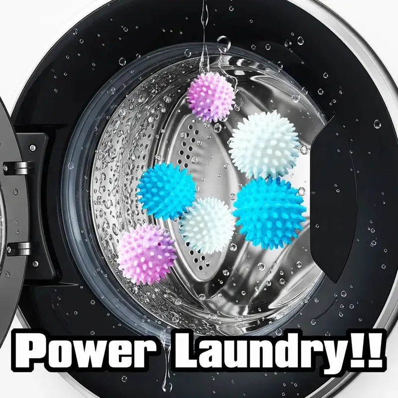 Close-up of reusable laundry balls in various colors floating in water inside a black washing machine drum.