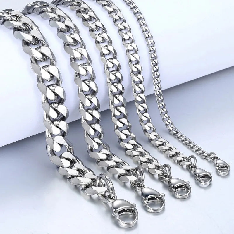 Silver stainless steel Cuban link bracelet chains displayed on a white background