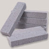 Stack of gray pumice stone cleaning sticks for removing tough stains