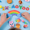 A colorful air dry clay modeling set with various tools and shapes arranged on a blue background.