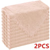 A stack of six raw-edge, light pink polyester cloth napkins.