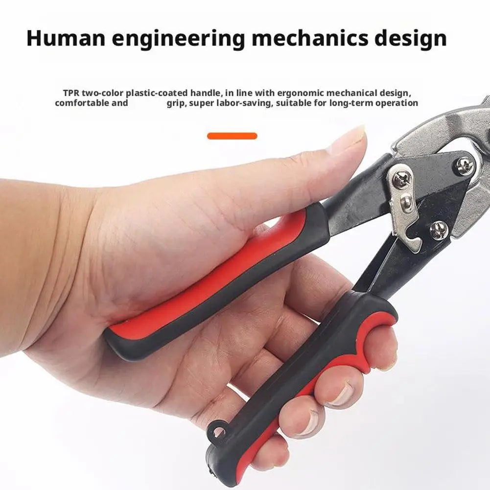 A hand holds a pair of red and black plastic-coated pliers designed for mechanical work.