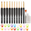 A set of black and gold ergonomic crochet hooks with various sizes and shapes.