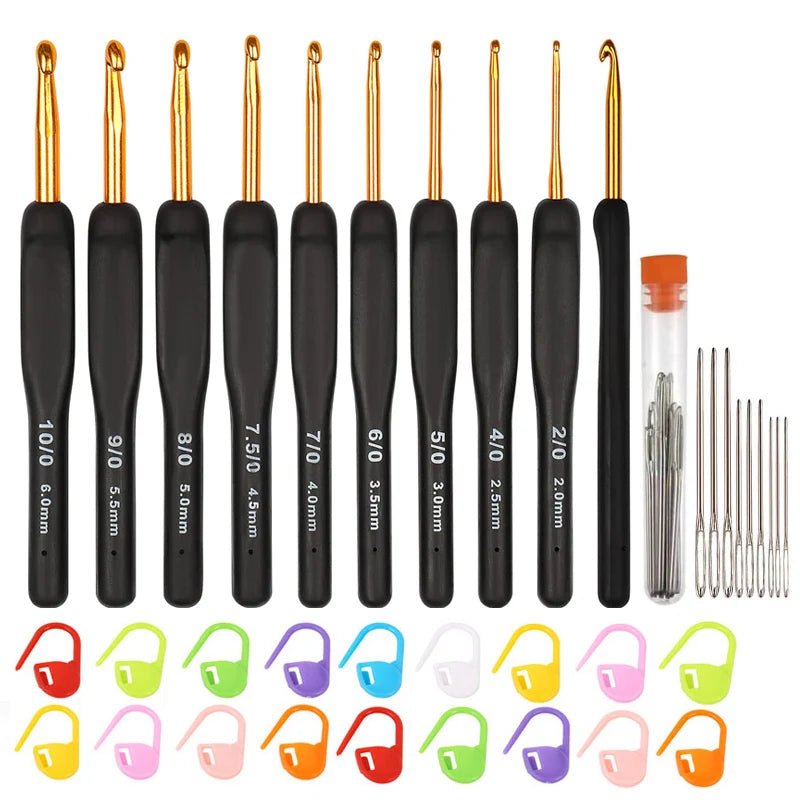 A set of black and gold ergonomic crochet hooks with various sizes and shapes.