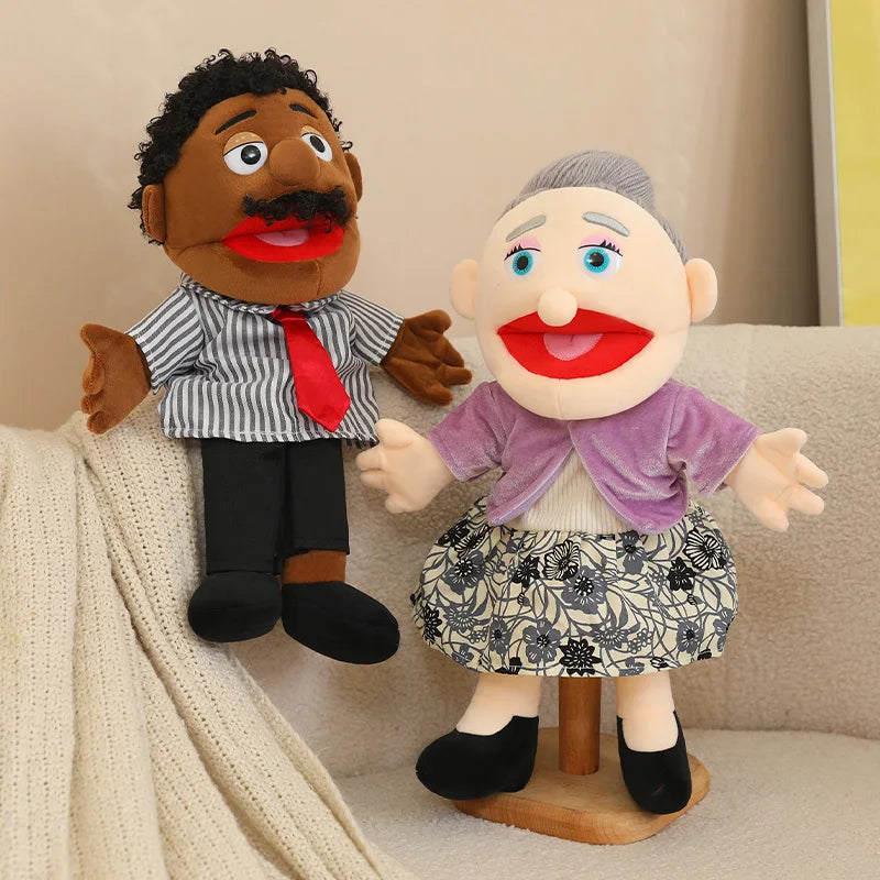 A hand puppet set featuring two characters, a dark-skinned man and a white woman, used for storytelling and role play.