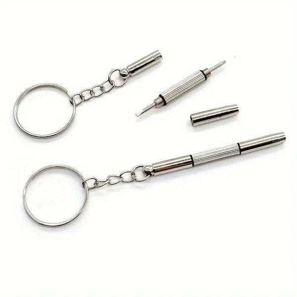 A silver pocket precision screwdriver keychain with a circular loop and a pointed tip.