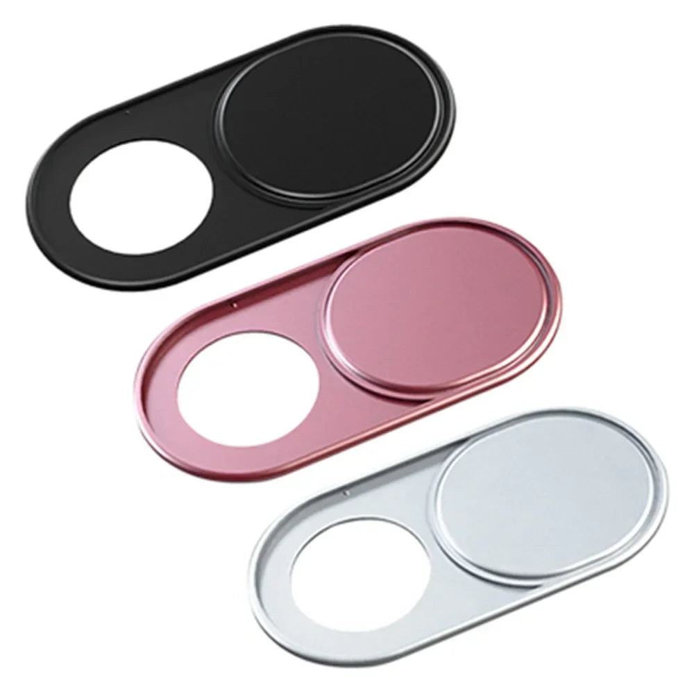 Three magnetic webcam covers in black, pink, and silver for laptops, tablets, and phones