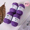 Purple Milk Cotton yarn skeins displayed on a white background with a dried leaf.