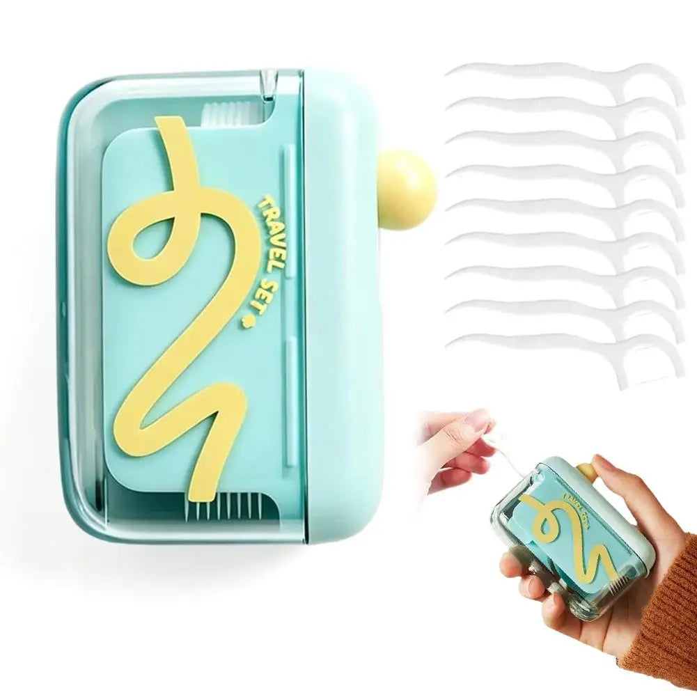 A teal portable automatic floss pick dispenser with a yellow swirl design and a set of white floss picks.