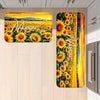 A long, rectangular sunflower mat with elegant script welcoming text, featuring vibrant yellow and orange tones.