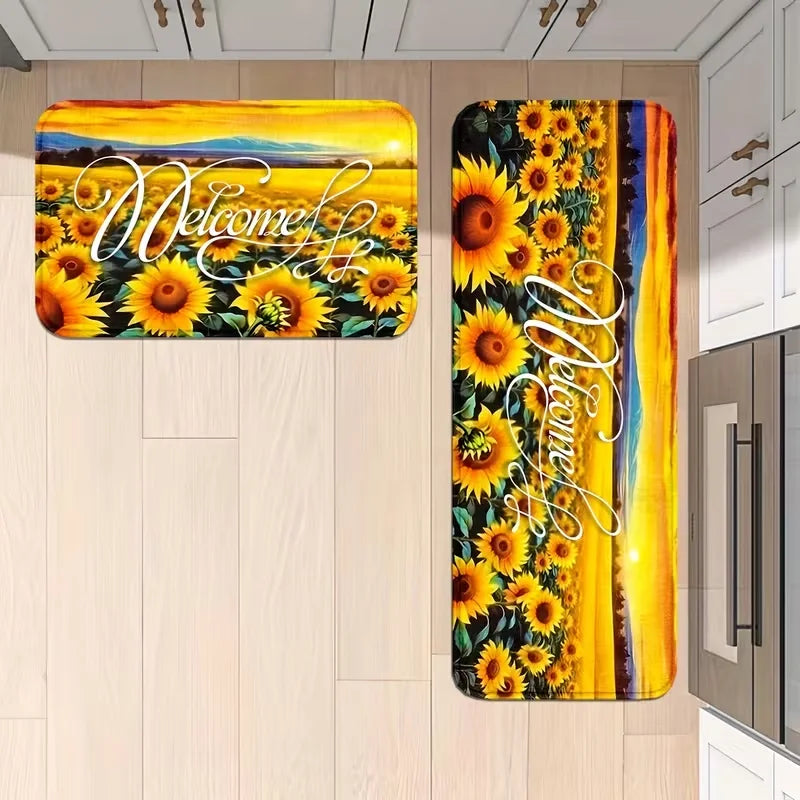 A long, rectangular sunflower mat with elegant script welcoming text, featuring vibrant yellow and orange tones.