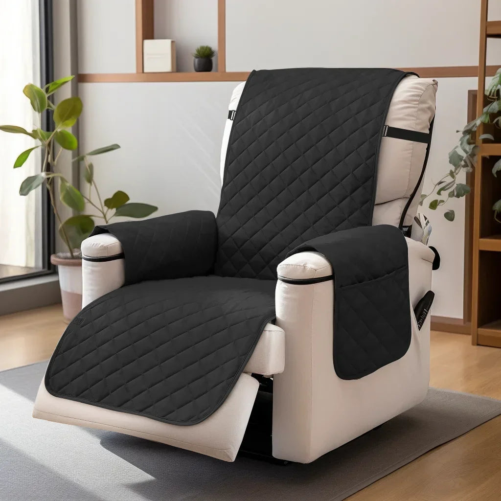 A black waterproof non-slip recliner sofa cover with side pockets shown on a white chair.