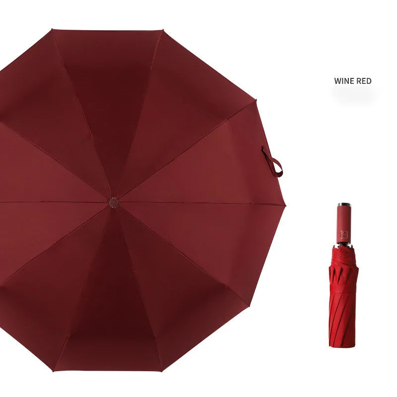 A deep wine red automatic foldable umbrella with a red handle shown open.