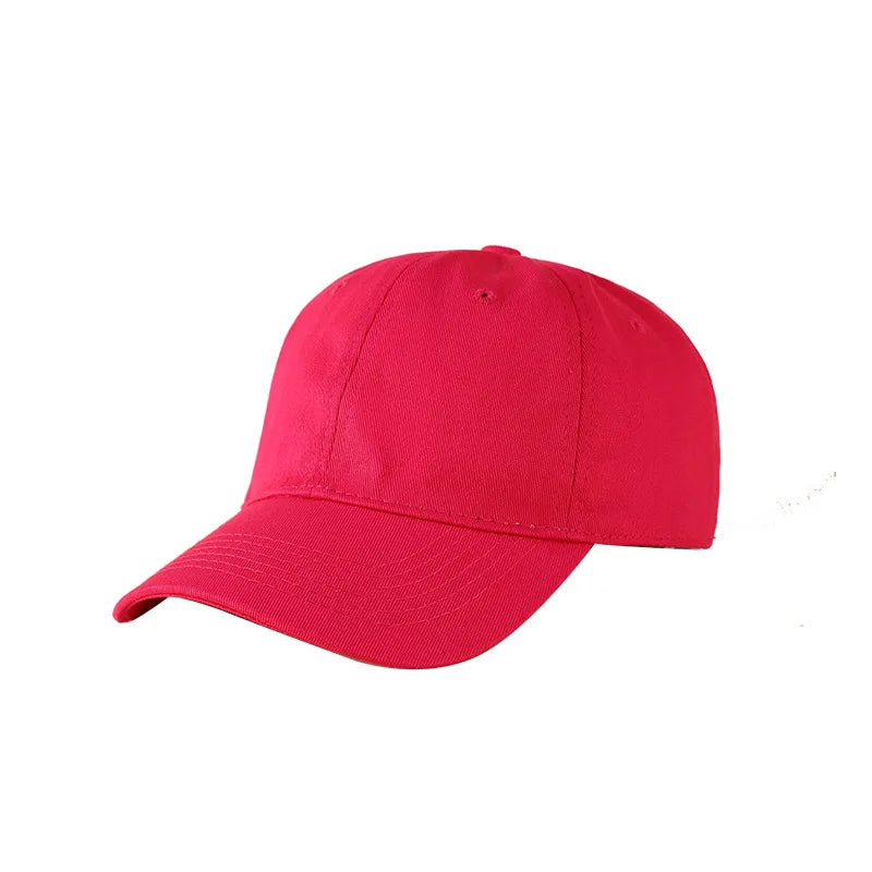 A bright pink or magenta classic cotton dad hat shown from the side.