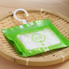 A green plastic bag filled with white moisture absorber material is hanging on a bamboo basket.