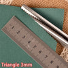 A pair of metal triangle pinking shears is shown next to a ruler measuring 9 cm.