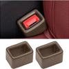 Two protective covers for car seatbelt buckles, one dark brown and one red.