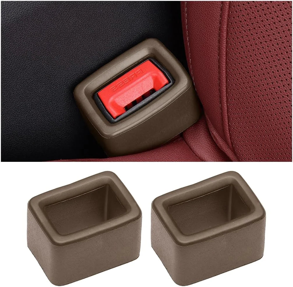 Two protective covers for car seatbelt buckles, one dark brown and one red.