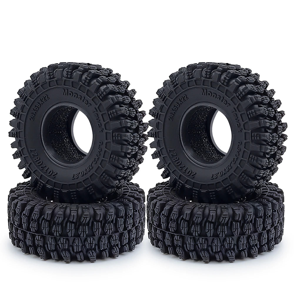 A pair of black rubber mud terrain tires for Axial SCX24 and TRX4M