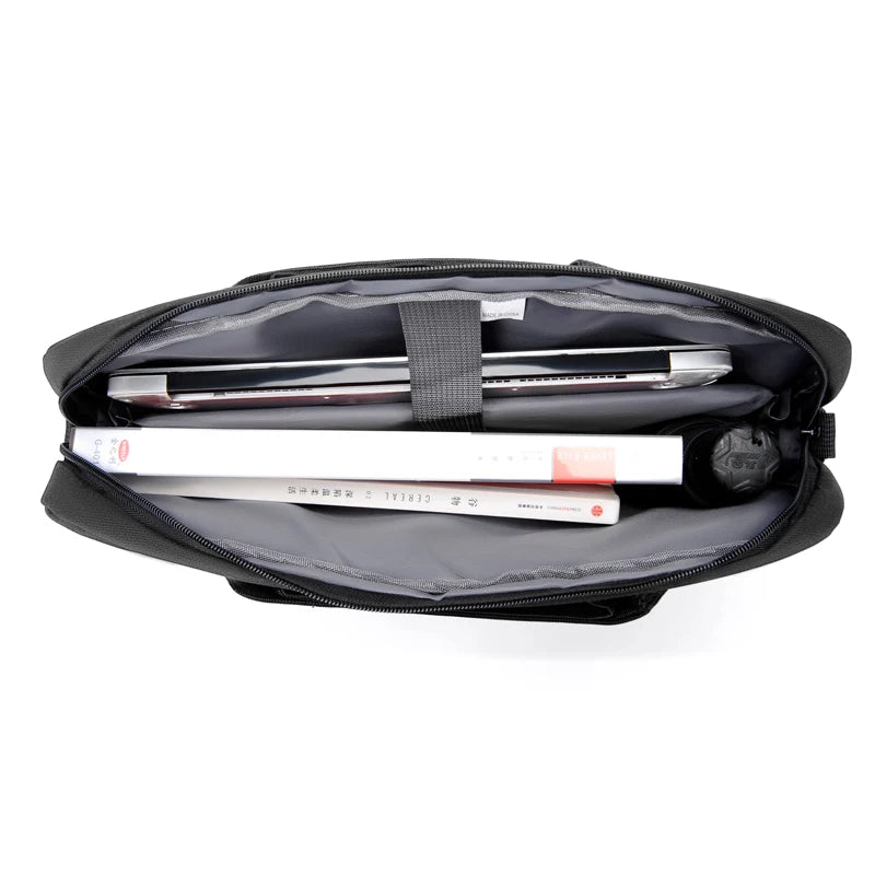 Black laptop briefcase with a padded interior and a laptop resting inside.