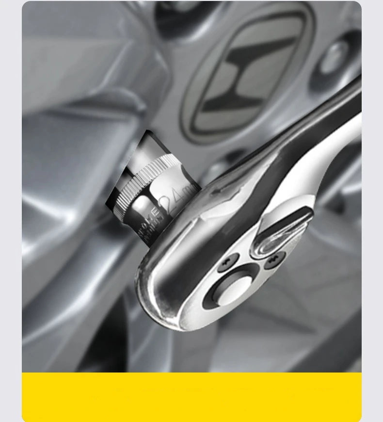 Close-up of a chrome-vanadium steel socket set and ratchet handle on a tool.