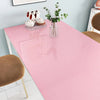 Glitter pink peel-and-stick vinyl contact paper used on a table with teacups and a vase of greenery.