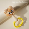 A cute little bear sandhammer toy with a yellow ring, shown in a close-up on a light background.