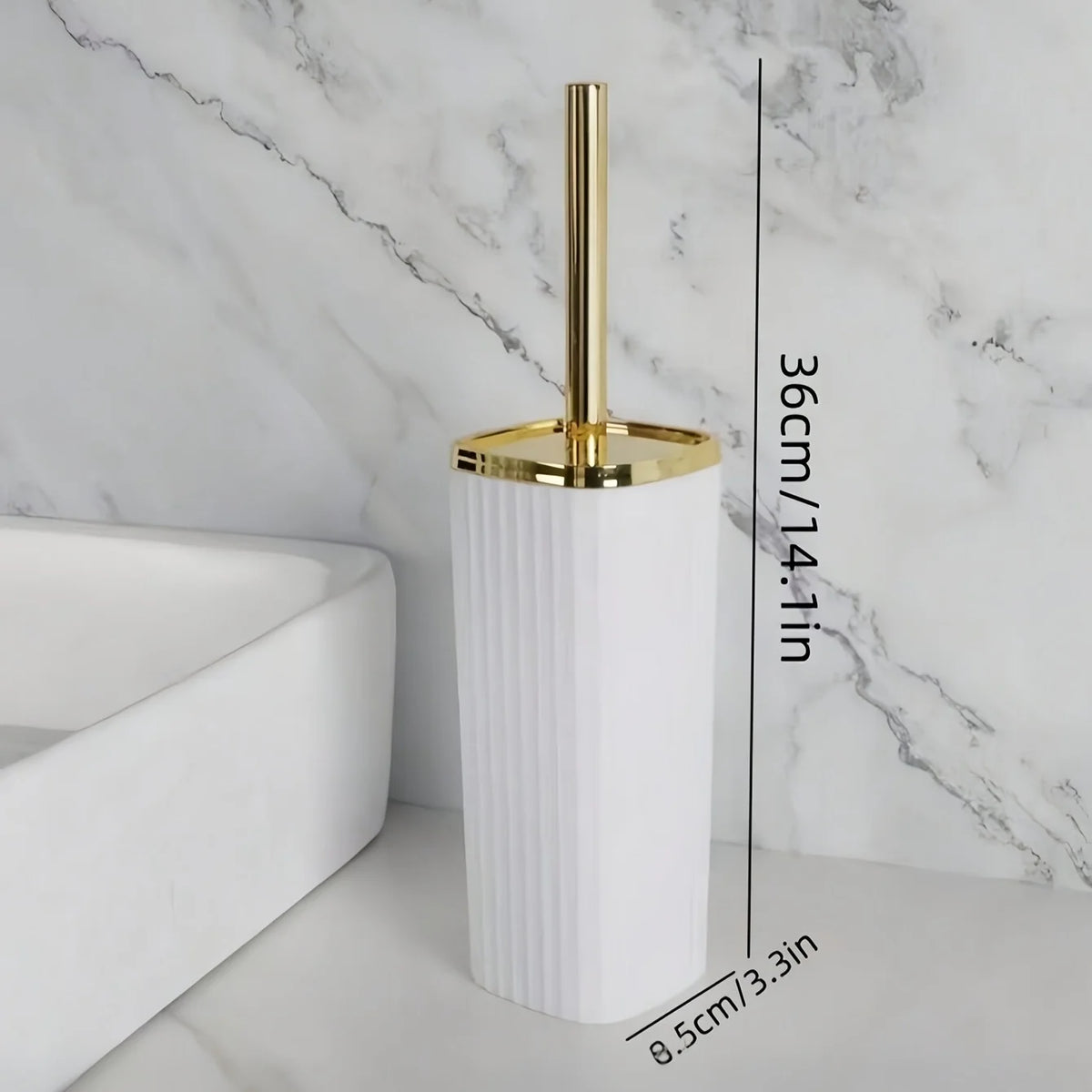 A tall white toilet brush set with a gold rotating stand displayed on a marble surface.