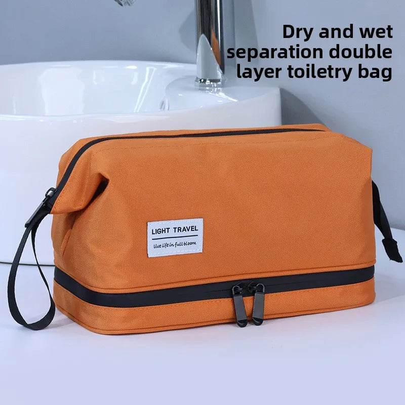 An orange double layer toiletry bag for travel, featuring separate dry and wet compartments.