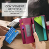 A person holds a pink crossbody phone wallet with hidden card slots and a smartphone, demonstrating secure storage.
