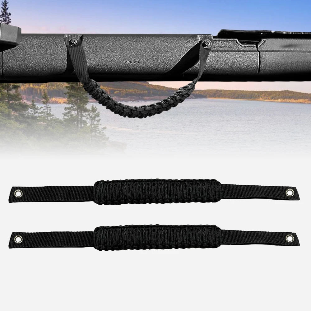 Black paracord grab handles for a Ford Bronco, shown attached to the vehicle's exterior.