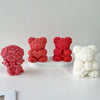 Three silicone bear molds in pink and white colors for crafting candles, soap, and resin