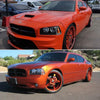 Orange Dodge Charger front side marker light housings with aftermarket wheels.