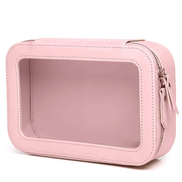 A pink waterproof travel makeup bag with a clear window and zipper detail.