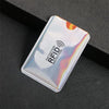 A silver aluminum card holder with an RFID protection symbol is shown on a dark surface.