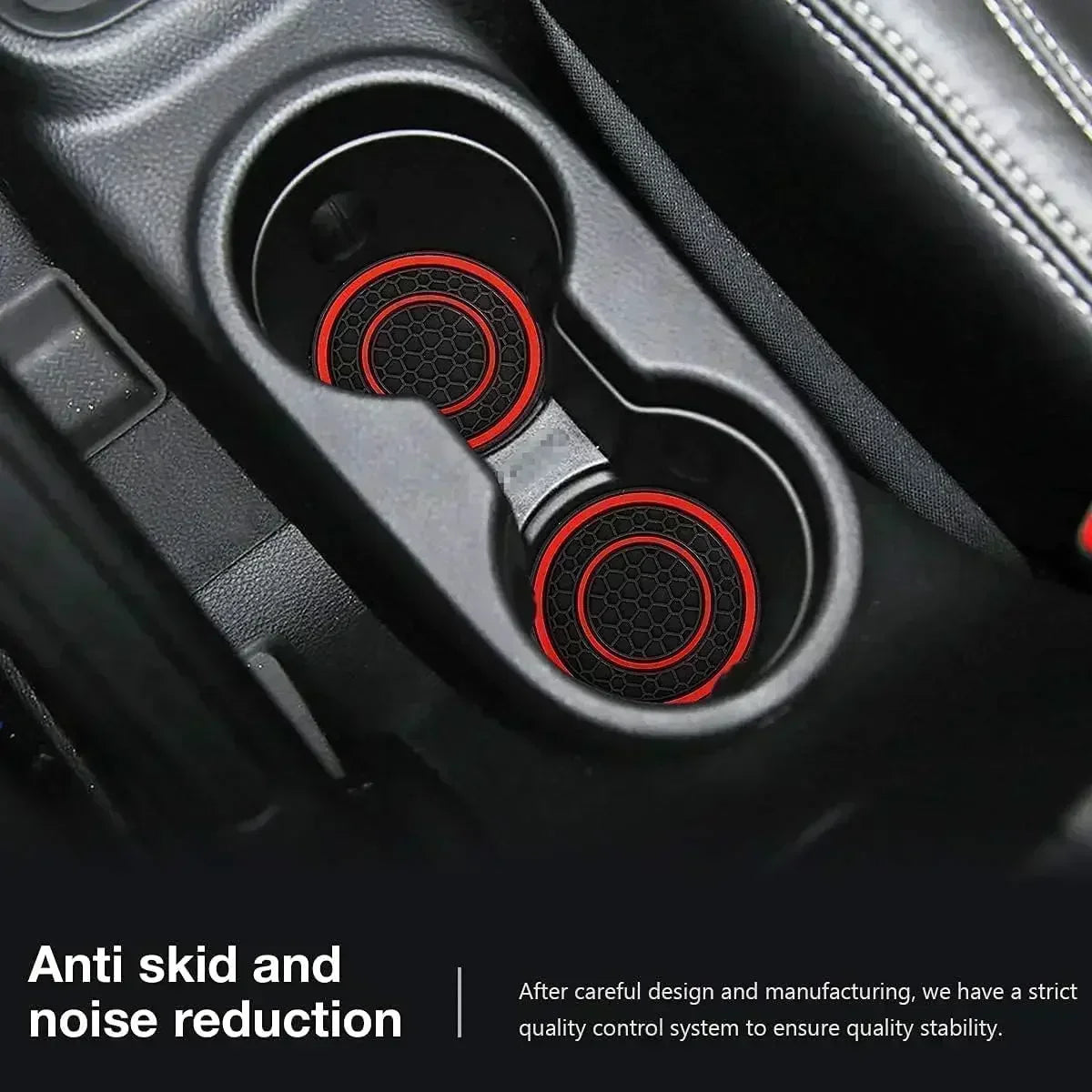 Close-up view of a black car cup holder with two red silicone coasters installed for anti skid and noise reduction.