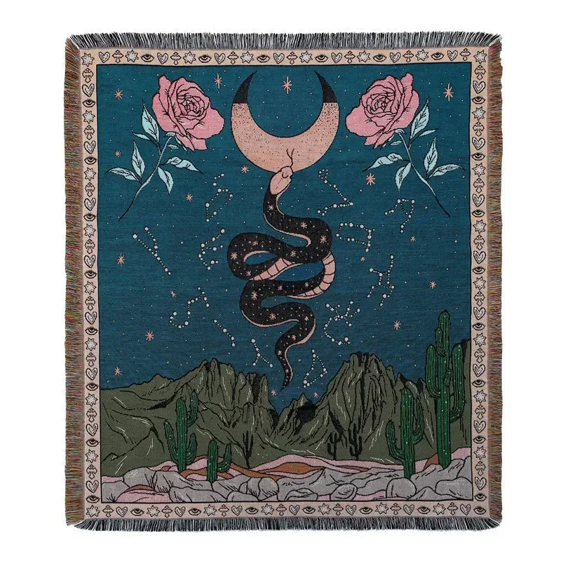 A dark teal woven blanket featuring a starry night sky and pink roses with a coiled black snake.