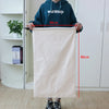 A person holds up an extra large heavy-duty canvas laundry bag measuring 48cm by 80cm.