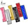 A set of ten harmonica keys in various colors including red, yellow, and blue for beginners